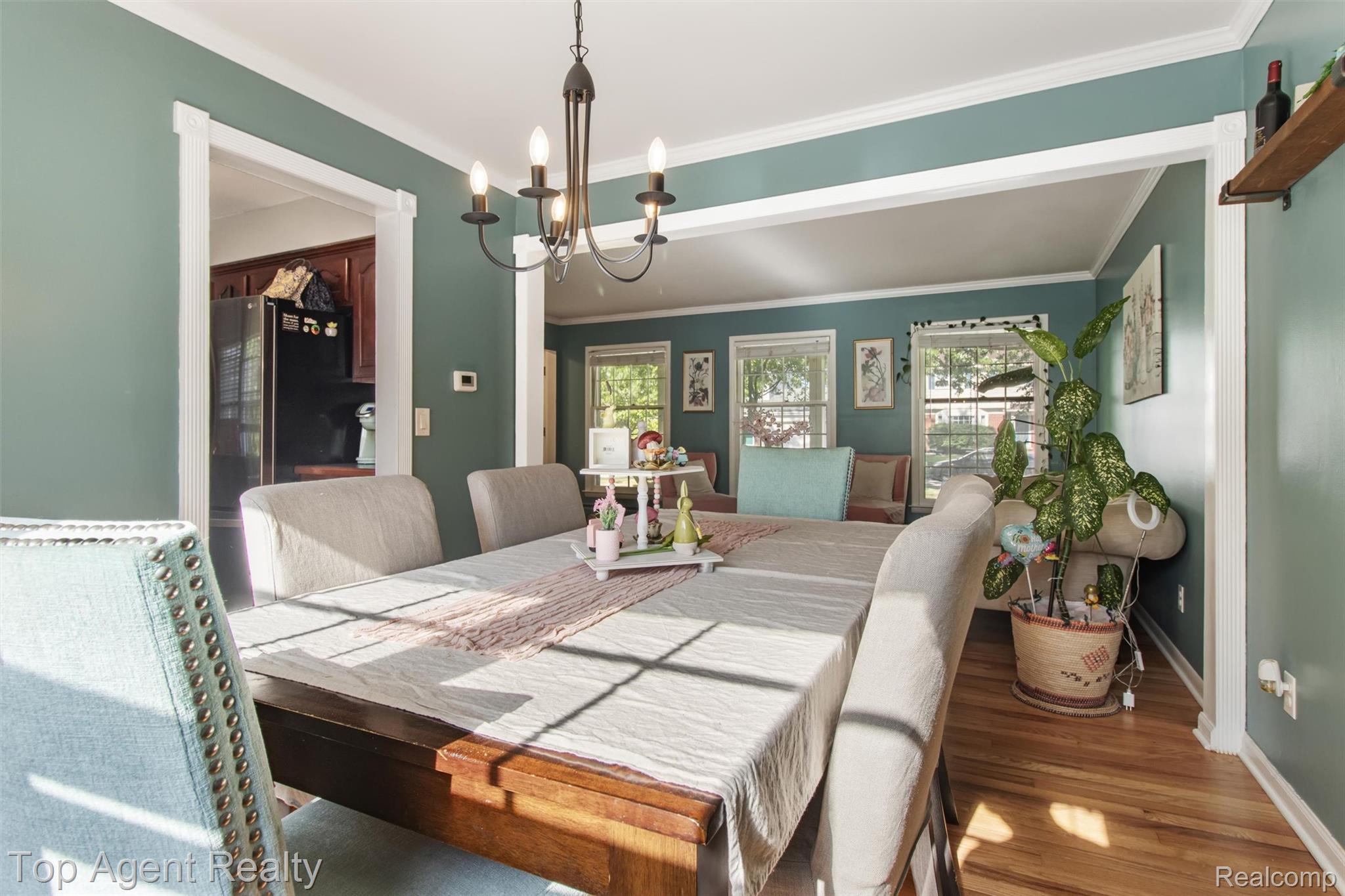 32341 Woody Road Fraser, MI 48026 - Photo 9 of 47 Dining area featuring hardwood flooring and a chandelier