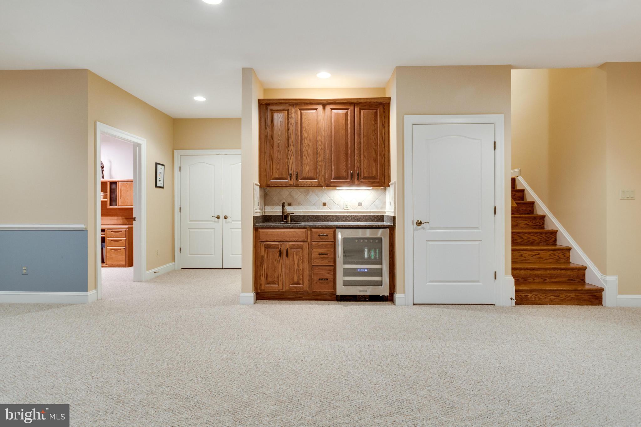 8720 Standish Road Alexandria, VA 22308 - Photo 25 of 30 Basement wet bar with beverage refrigerator