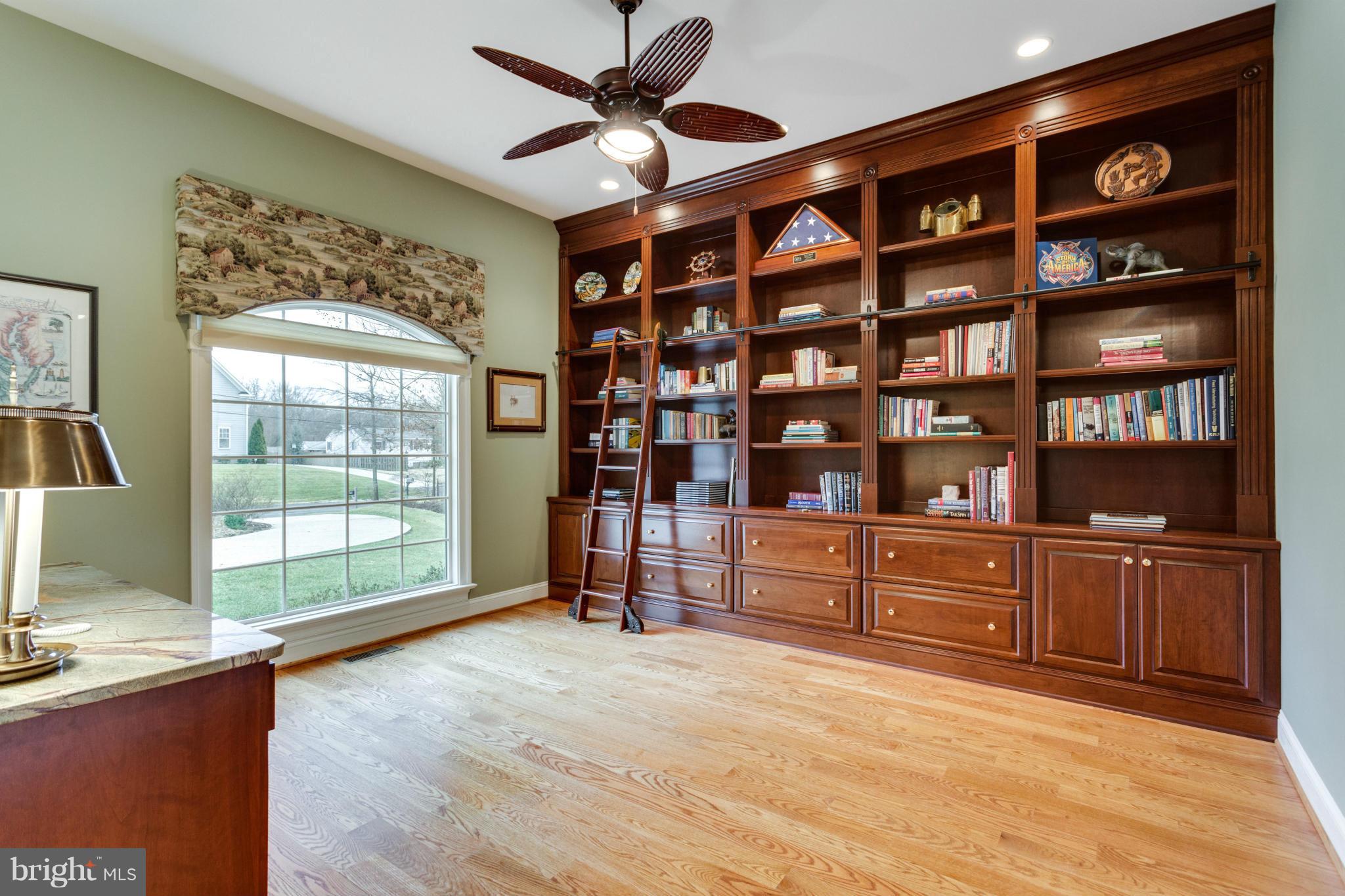 8720 Standish Road Alexandria, VA 22308 - Photo 9 of 30 Elegant bookshelves lining the office wall