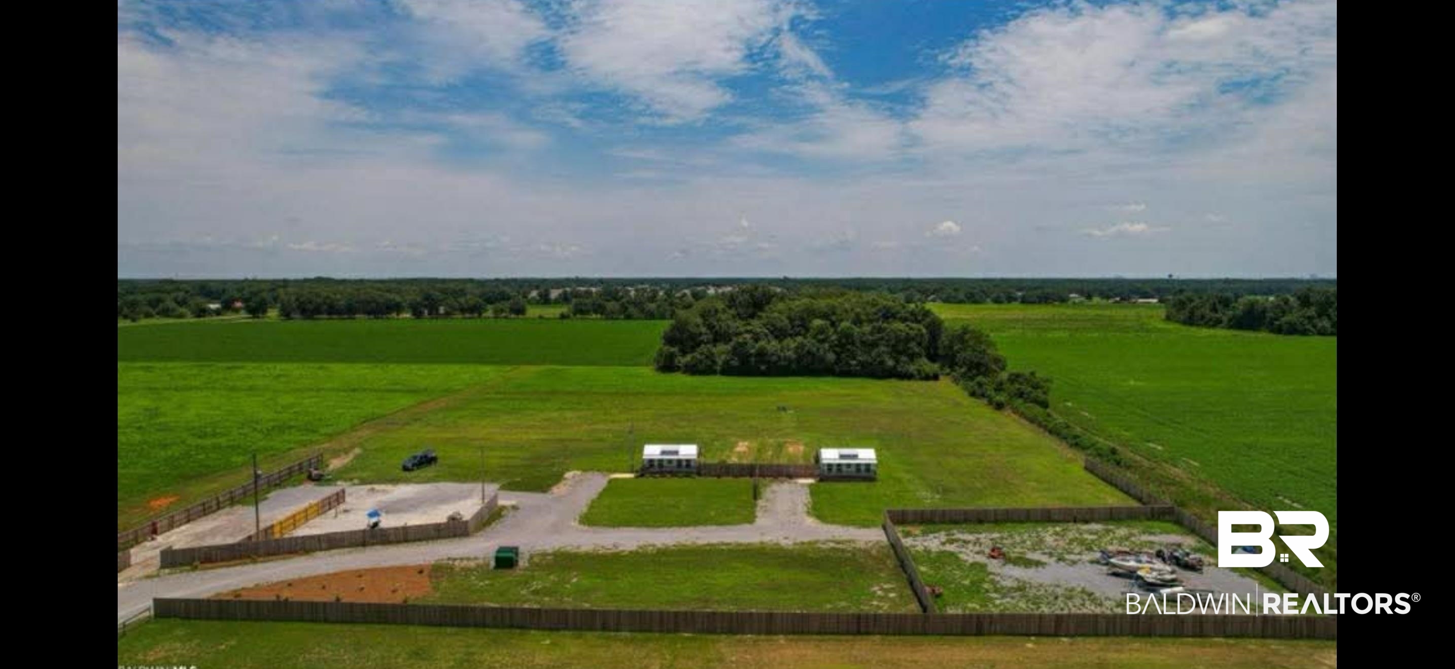 7826 County Road 19 Foley, AL 36535 - Photo 11 of 11 Aerial view of sparsely populated area with a pastoral area
