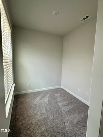 an entryway of a room with a window
