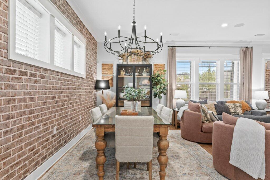 34 Caymus Cove Freeport, FL 32439 - Photo 20 of 42 a view of a dining room with furniture wooden floor and chandelier