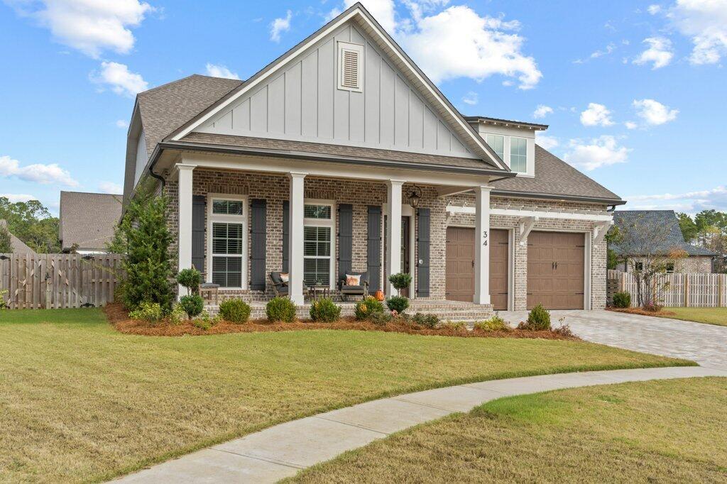 34 Caymus Cove Freeport, FL 32439 - Photo 3 of 42 a front view of a house with a yard