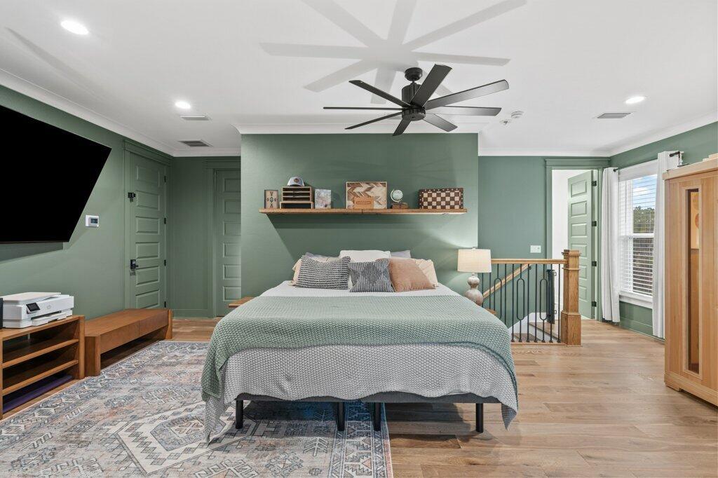 34 Caymus Cove Freeport, FL 32439 - Photo 33 of 42 a bedroom with a bed and a flat screen tv