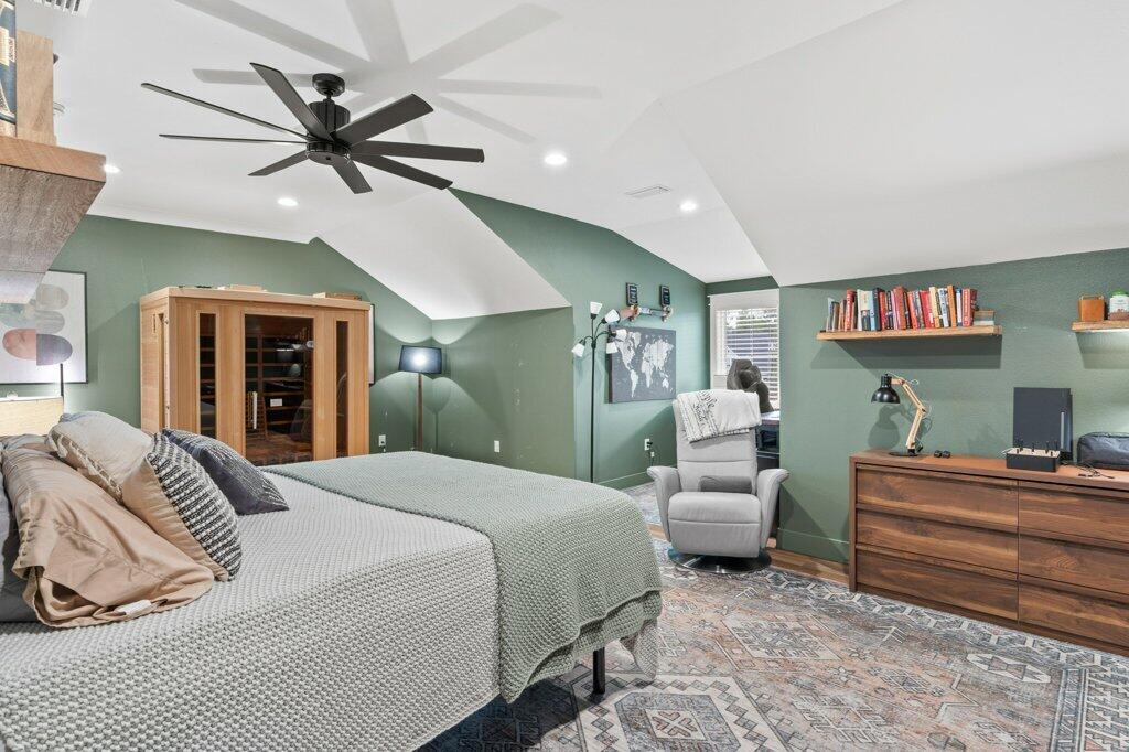 34 Caymus Cove Freeport, FL 32439 - Photo 34 of 42 a bedroom with a bed and a chandelier