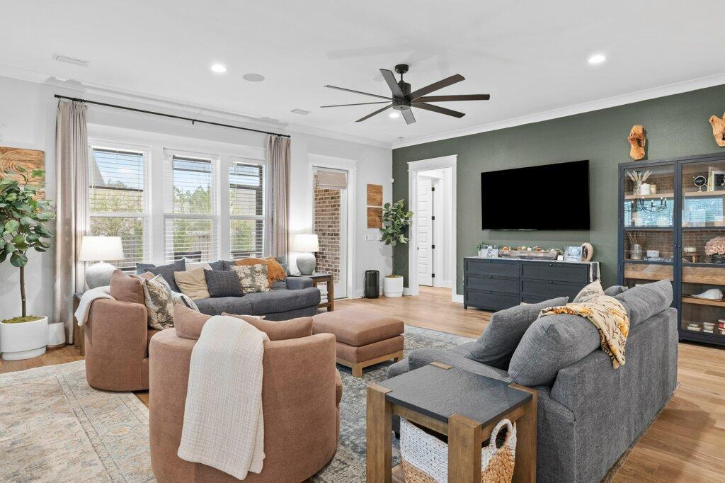 34 Caymus Cove Freeport, FL 32439 - Photo 10 of 42 a living room with furniture a flat screen tv and a large window