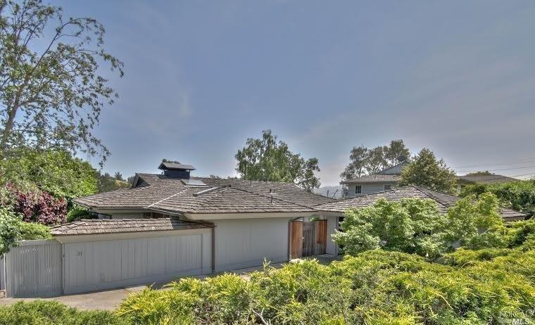 Street view of this well cared for Enchanted Knolls home.