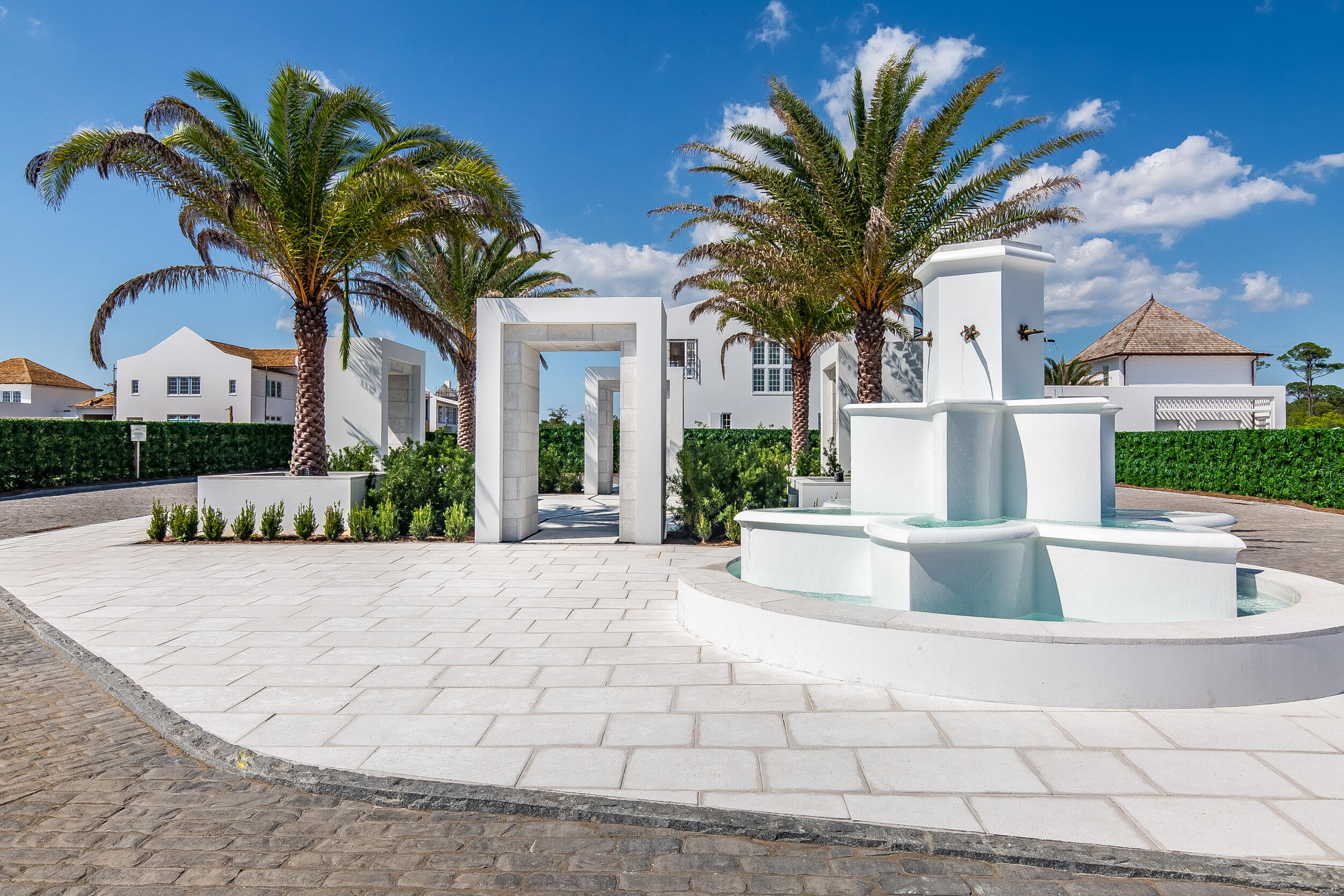 45 West Solaire Way Inlet Beach, Unit PH 2 Inlet Beach, FL 32461 - Photo 5 of 12 a view of white house with a fountain and a potted plant