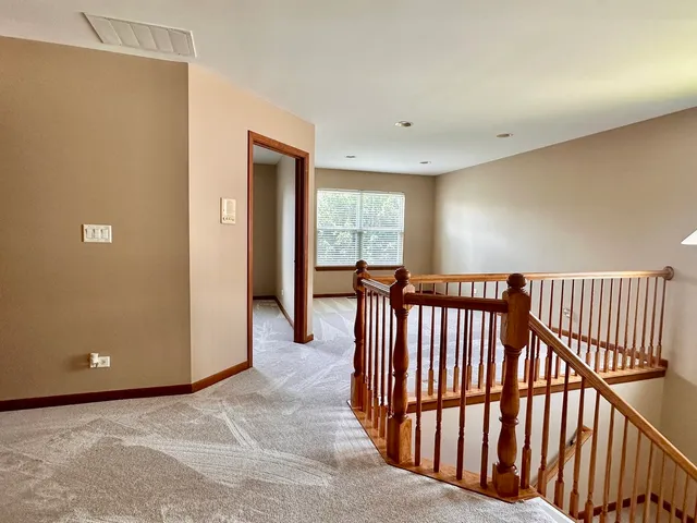 a view of a hallway with windows