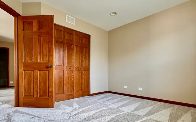 a view of a hallway with closet area
