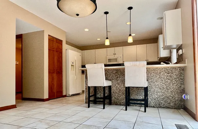 a view of kitchen with furniture and window