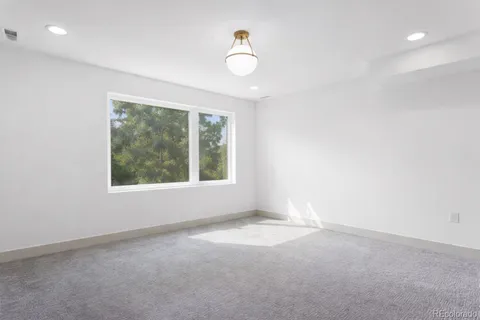 an empty room with windows and yard