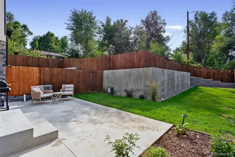 a view of outdoor space with patio furniture and garden