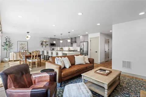 a living room with furniture and a table