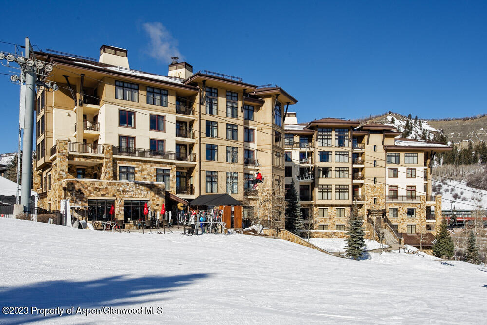 130 Wood Road, Unit 507 Snowmass Village, CO 81615 - Photo 23 of 27 a front view of a building with a street