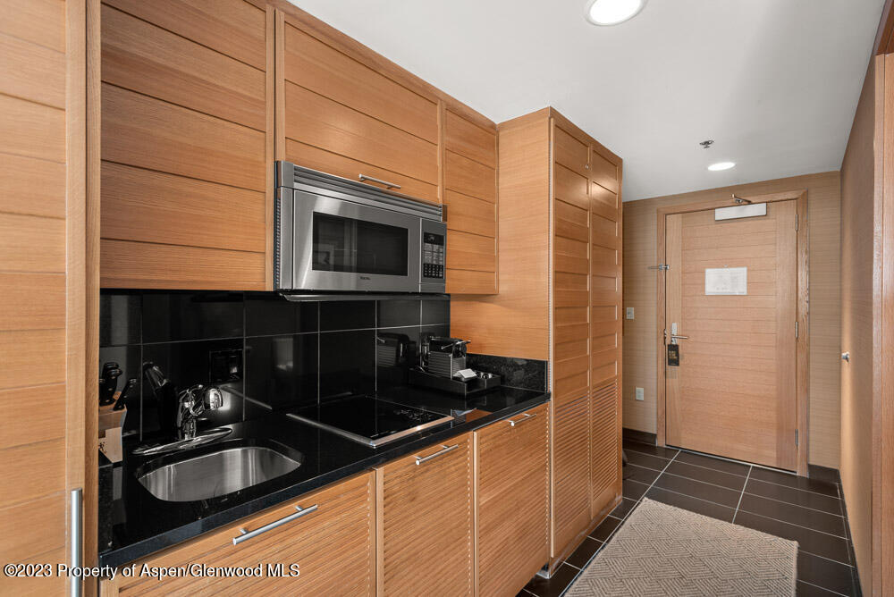 130 Wood Road, Unit 507 Snowmass Village, CO 81615 - Photo 5 of 27 a kitchen with sink and cabinets