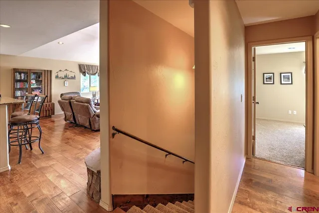a view of hallway with furniture and a window