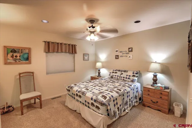 a bedroom with a bed and a chair