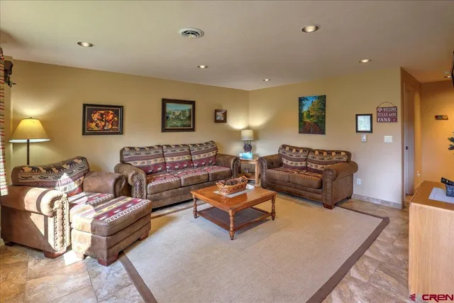 a living room with furniture and a table
