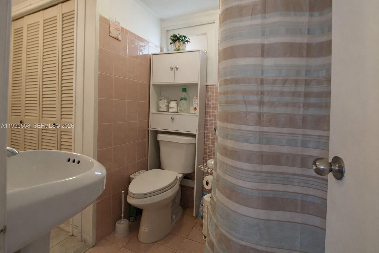 2314 Southwest 60th Avenue Miami, FL 33155 - Photo 17 of 45 a bathroom with a toilet and a shower