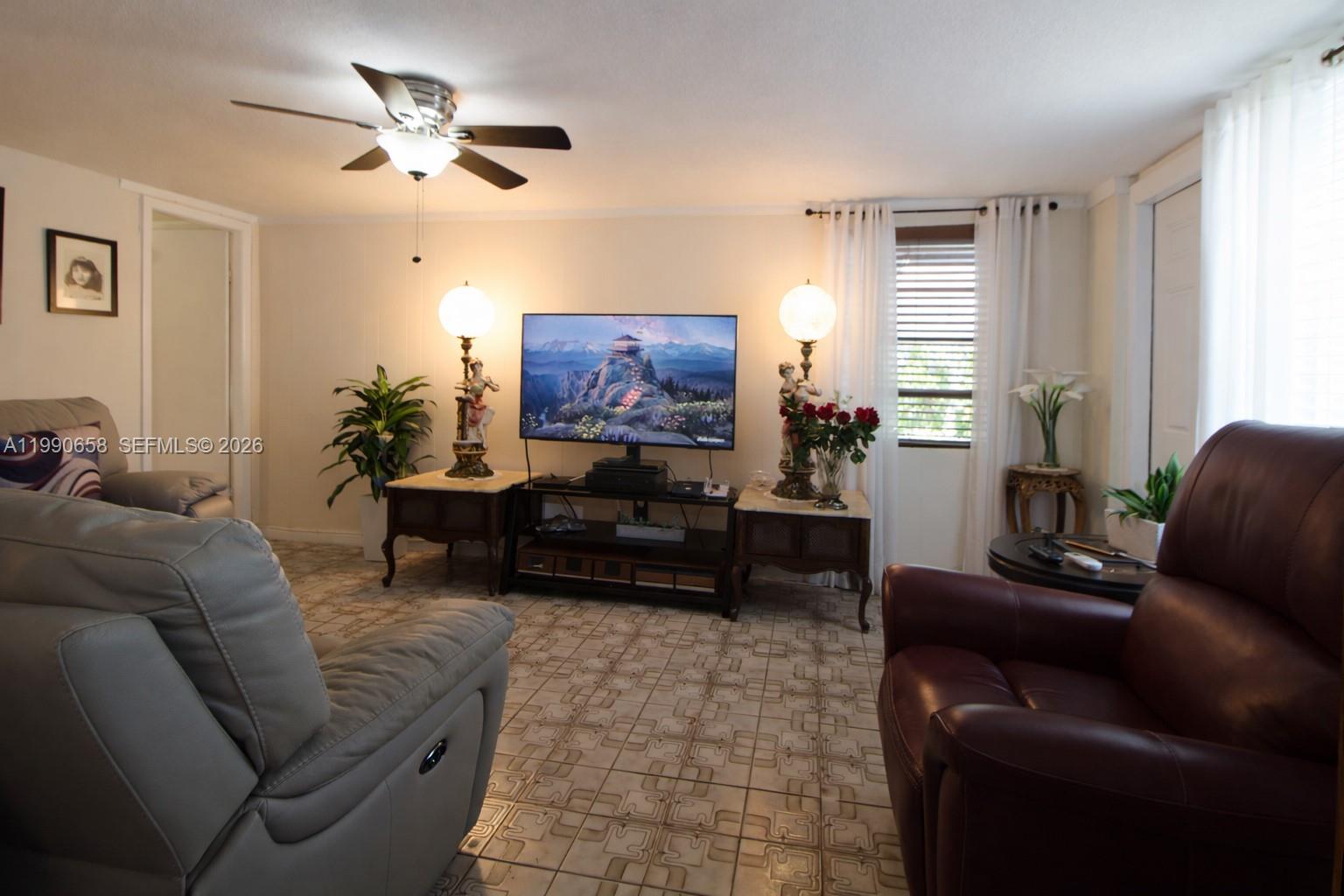 2314 Southwest 60th Avenue Miami, FL 33155 - Photo 20 of 45 a living room with furniture and a flat screen tv