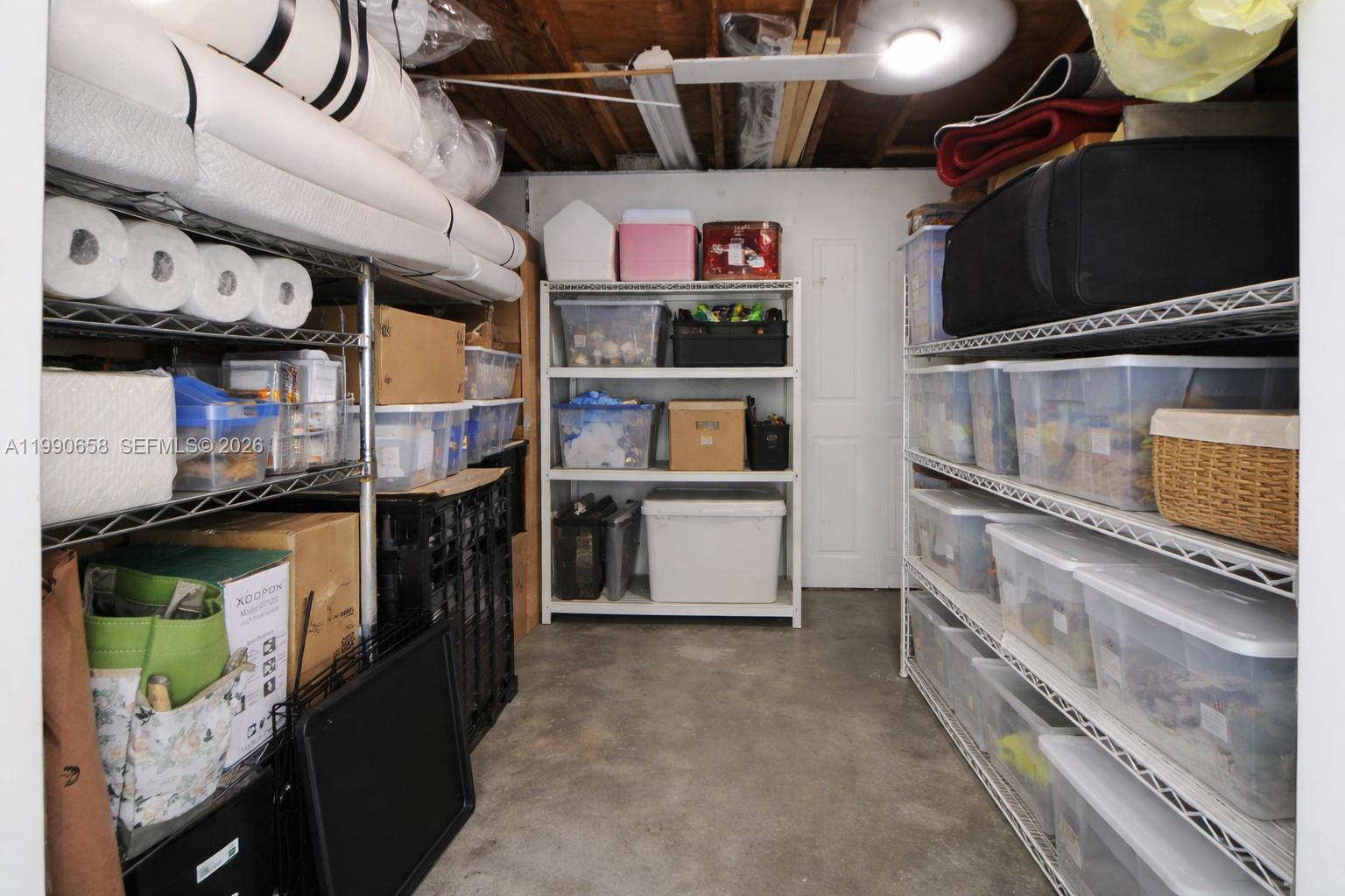 2314 Southwest 60th Avenue Miami, FL 33155 - Photo 32 of 45 a store room with lots of different colored cloths