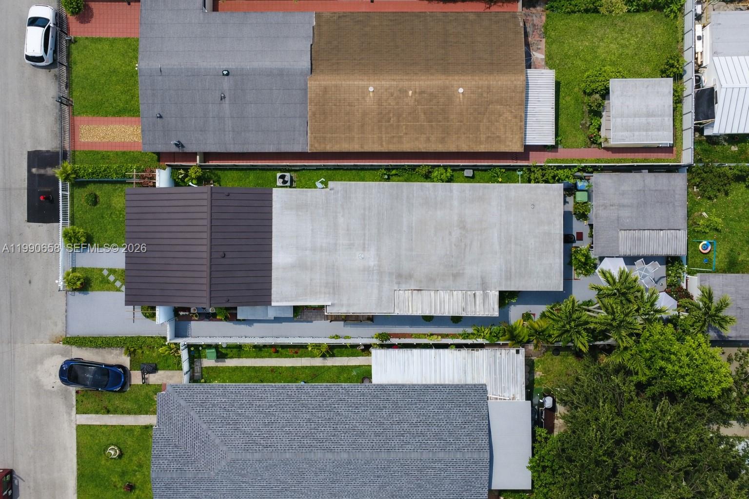 2314 Southwest 60th Avenue Miami, FL 33155 - Photo 37 of 45 an aerial view of a house with a yard and a large tree