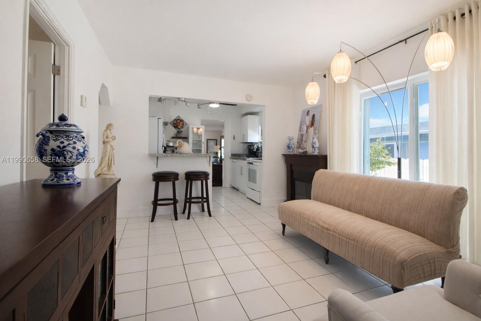 2314 Southwest 60th Avenue Miami, FL 33155 - Photo 5 of 45 a living room with furniture and a chandelier