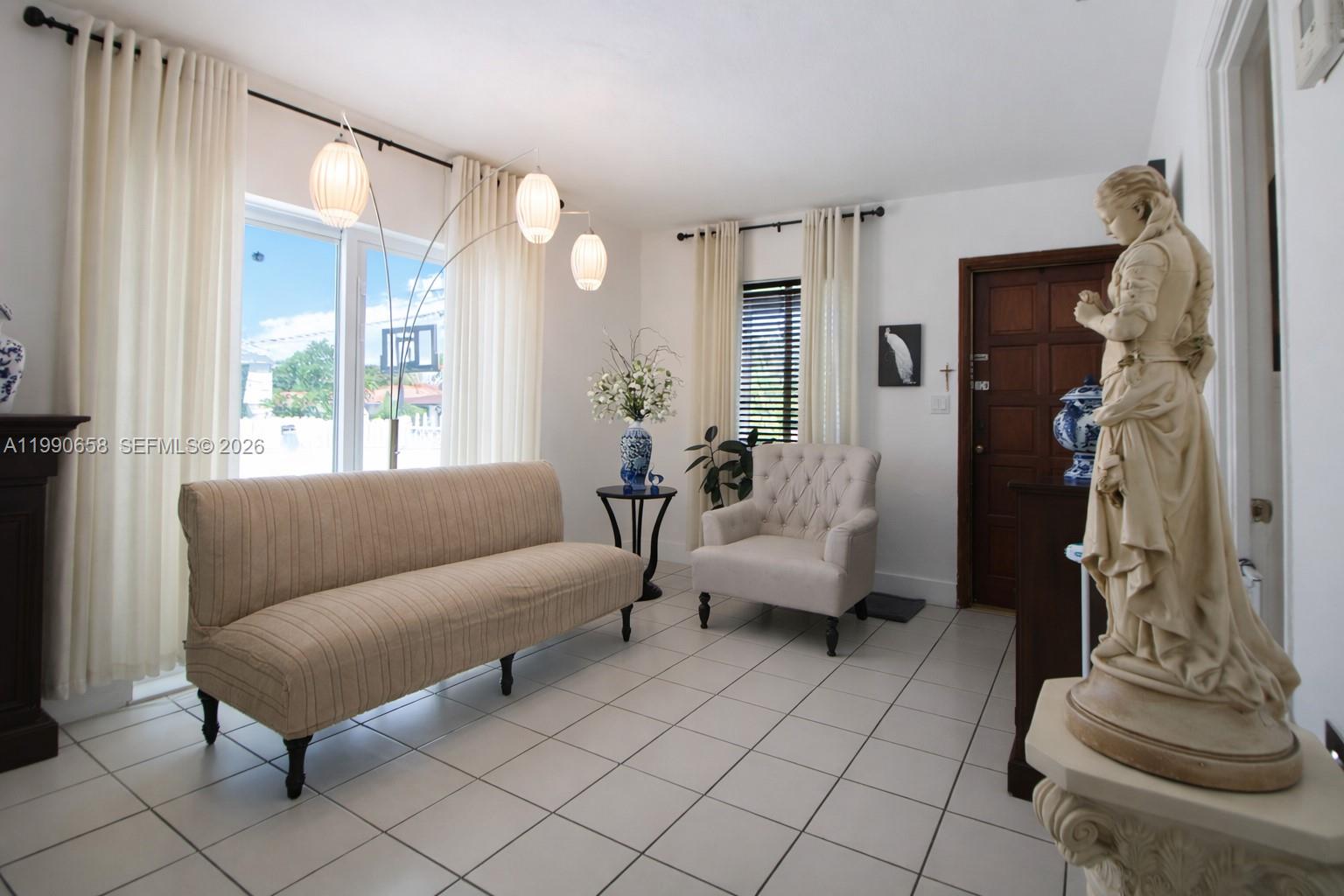 2314 Southwest 60th Avenue Miami, FL 33155 - Photo 6 of 45 a living room with furniture and a window