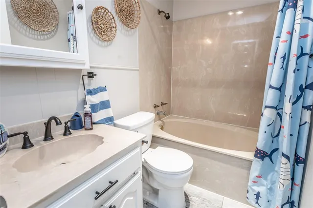 a bathroom with a sink a toilet and a bathtub