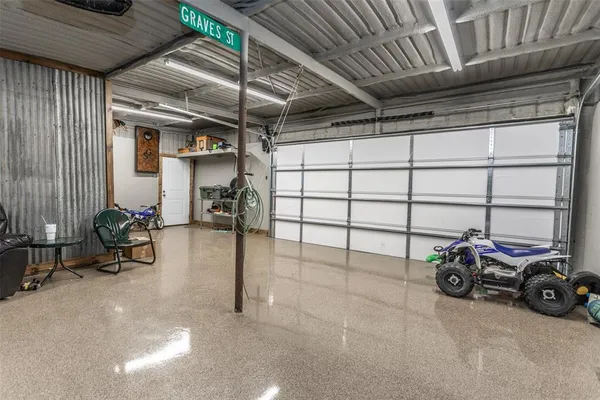 a view of a garage with parked cars