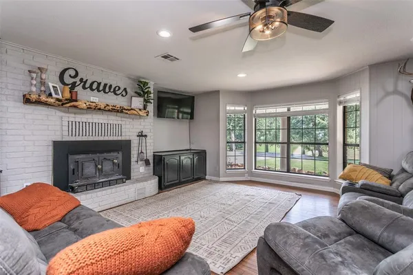 a living room with furniture and a fireplace