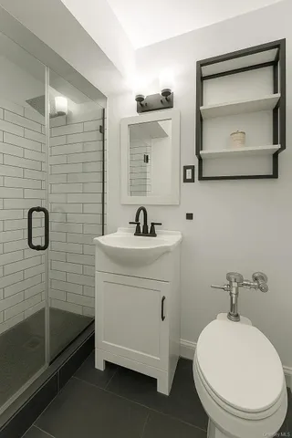 a bathroom with a sink a toilet and a mirror