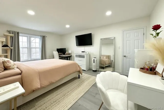 a bedroom with a bed and furniture