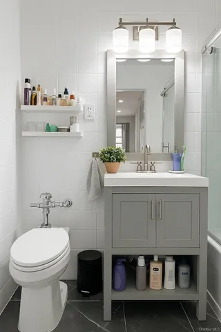 a bathroom with a sink mirror and toilet