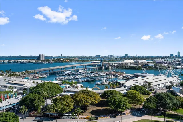 a utility room with furniture a potted plant and a window