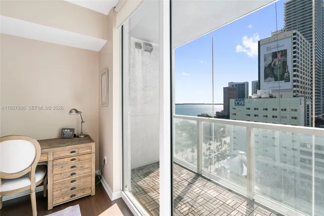 a bedroom with bed and windows