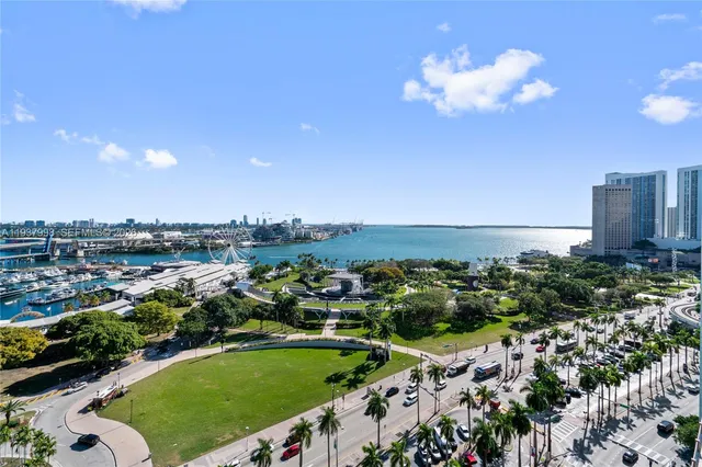 a bedroom with a bed couch and a window
