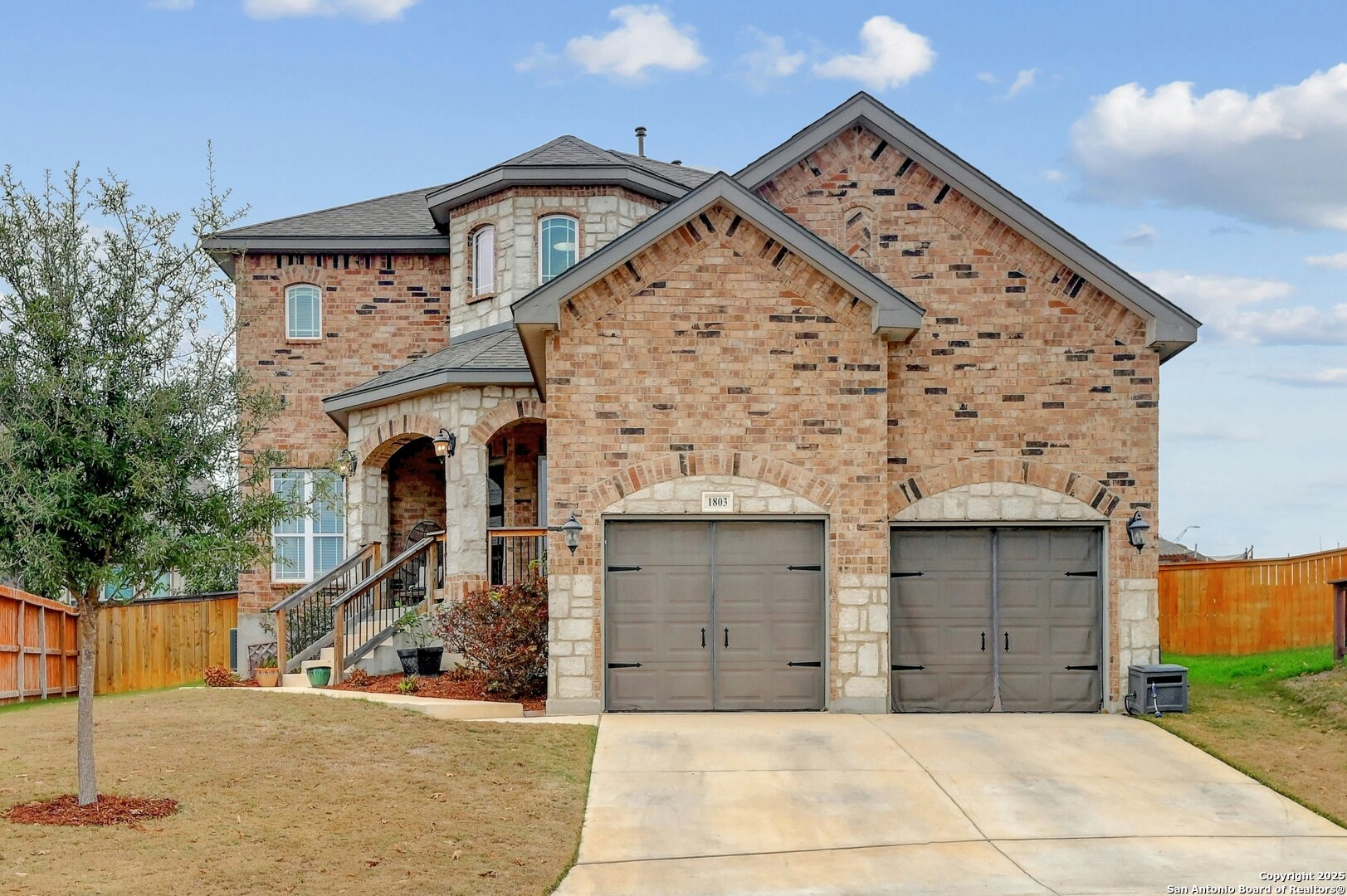 a front view of a house with garage