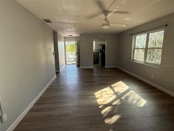 a view of gallery with wooden floor