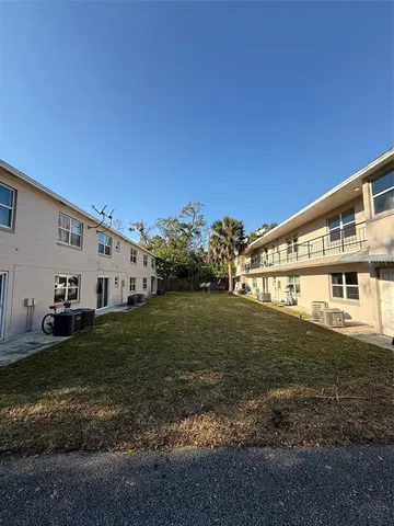 a view of a house with backyard