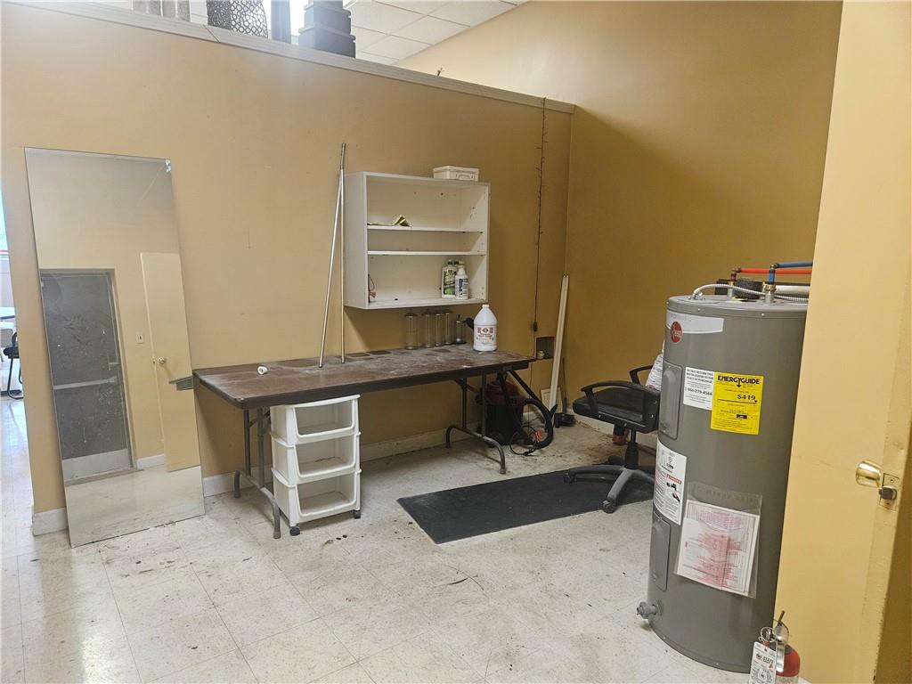 1503 Old Brodhead Road Monaca, PA 15061 - Photo 11 of 12 a room with a chair and appliances