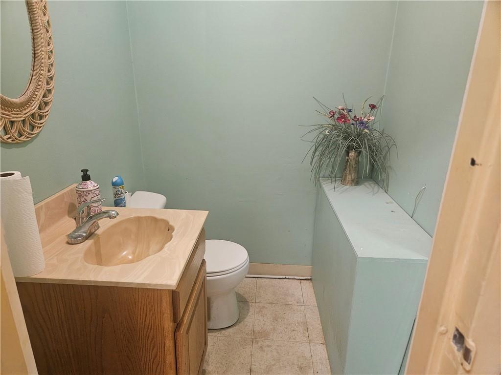 1503 Old Brodhead Road Monaca, PA 15061 - Photo 12 of 12 a bathroom with a sink toilet and a mirror