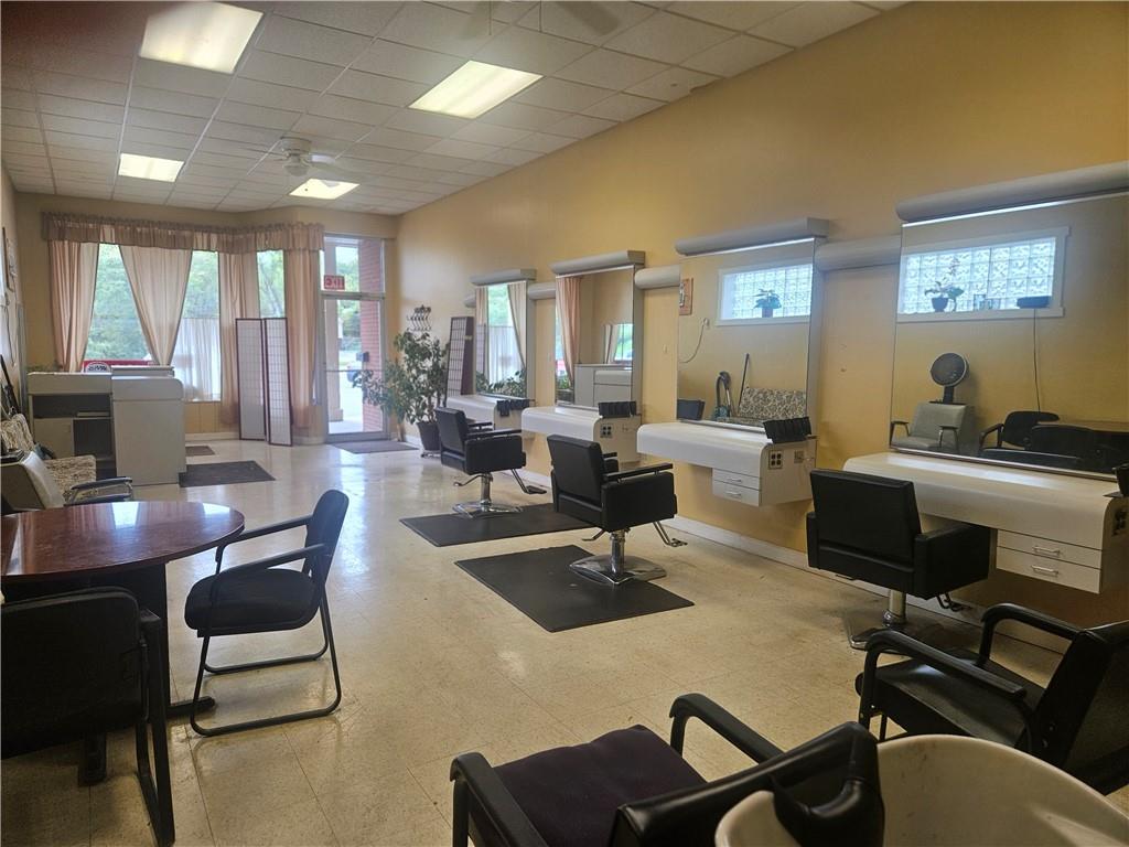 1503 Old Brodhead Road Monaca, PA 15061 - Photo 8 of 12 a living room with furniture flat screen tv and large windows