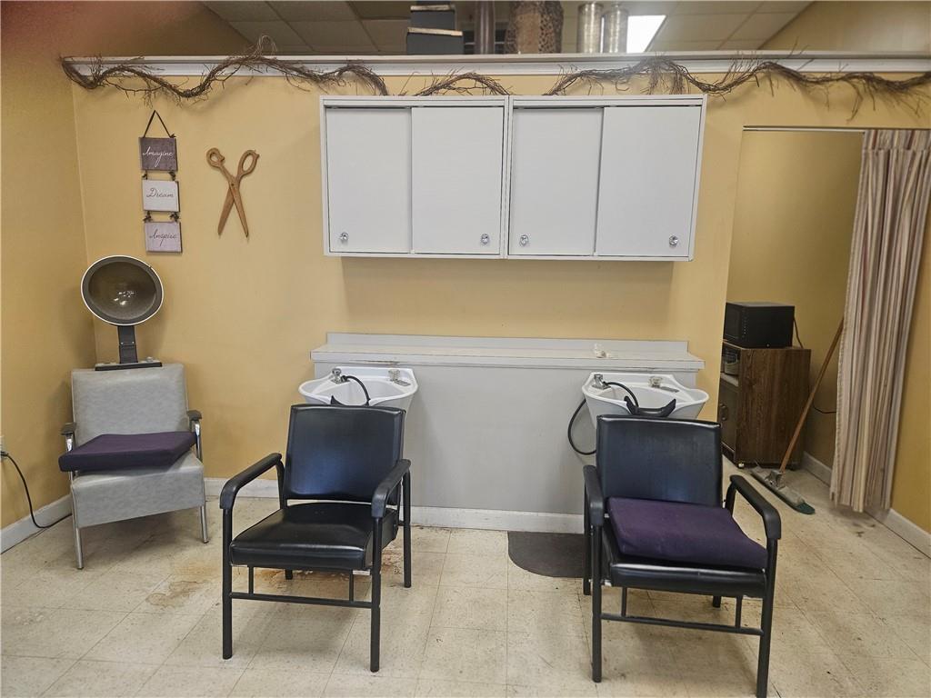 1503 Old Brodhead Road Monaca, PA 15061 - Photo 9 of 12 a view of a workspace with furniture and a lamp