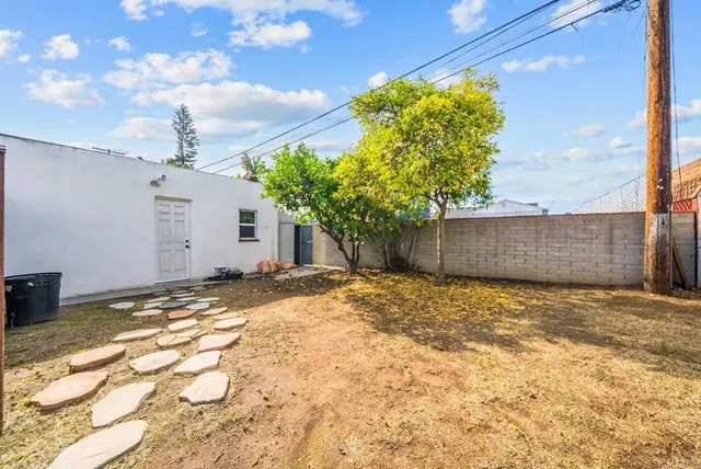 a view of backyard of a house