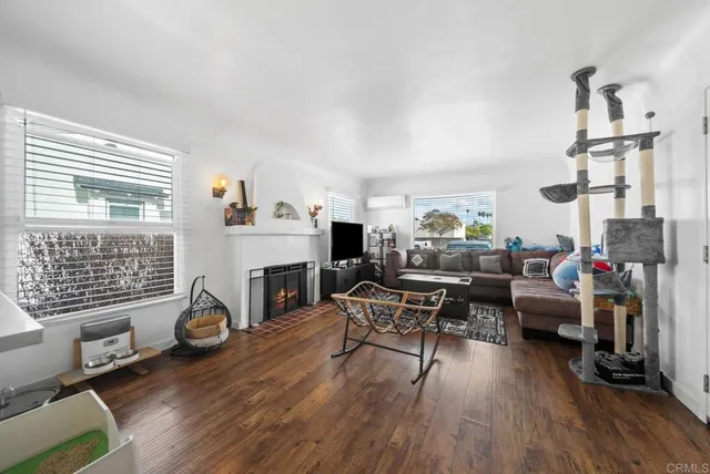 a living room with furniture and a fireplace