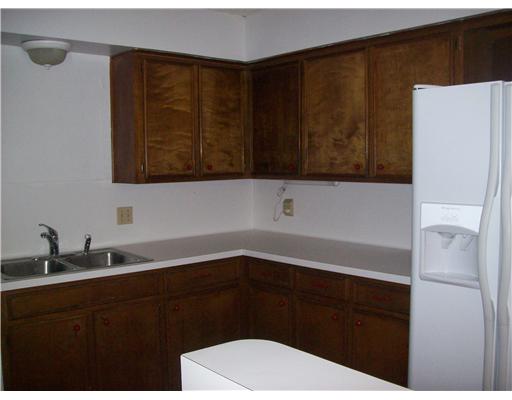 4934 High Meadow Drive Corpus Christi, TX 78413 - Photo 2 of 8 a bathroom with a sink a toilet and mirror