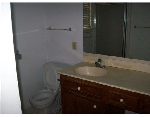 4934 High Meadow Drive Corpus Christi, TX 78413 - Photo 8 of 8 a bathroom with a sink and mirror