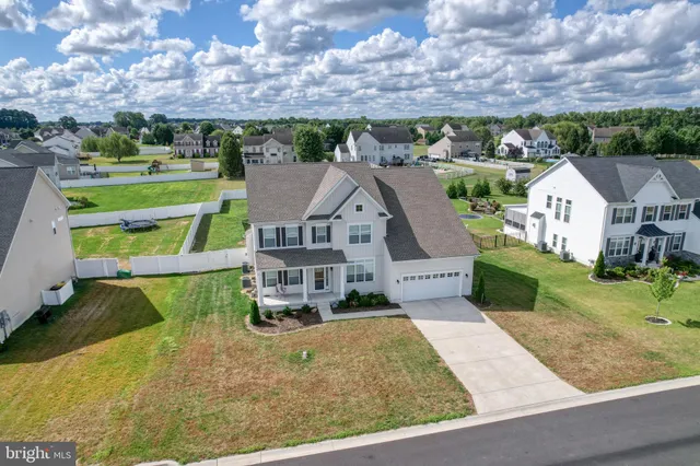 an aerial view of a house with a big yard